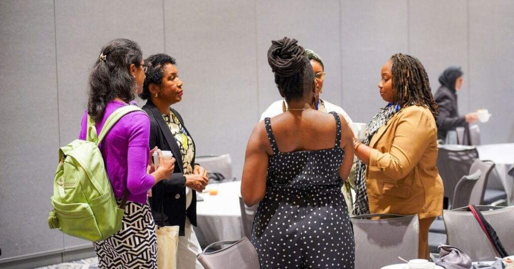 People engaged in conversation at the 2024 Birth Equity Funders Summit